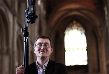 Ben Trenchard with a microphone for audio recording